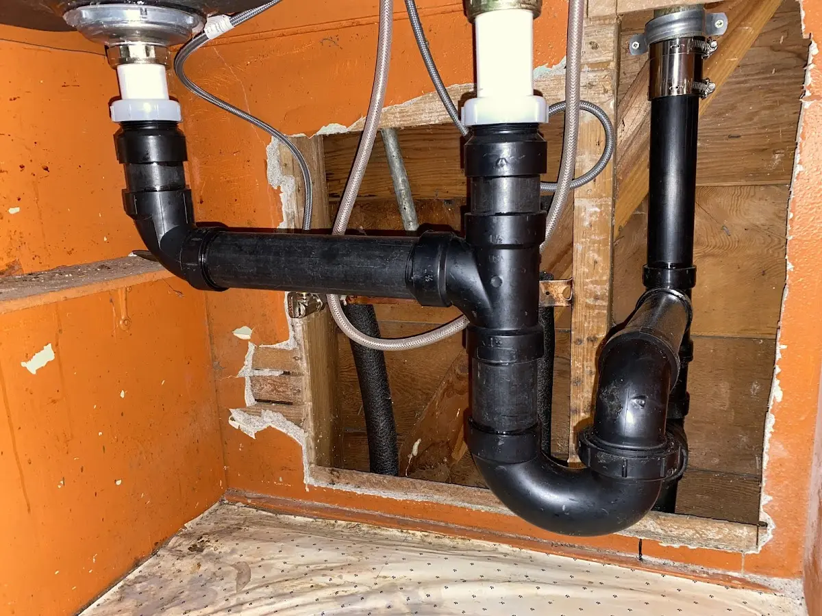 Professional Garbage Disposal Repair equipment and tools on the job in Eaton
